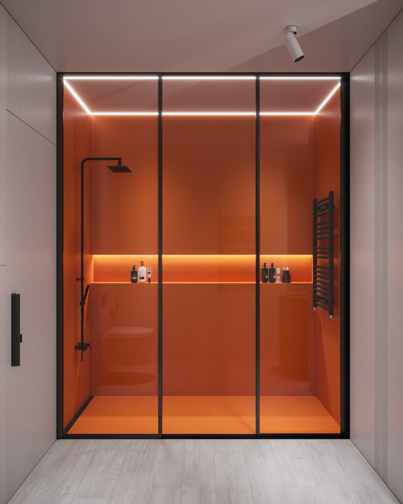 Sleek modern shower with orange glass panels, minimalistic and elegant.